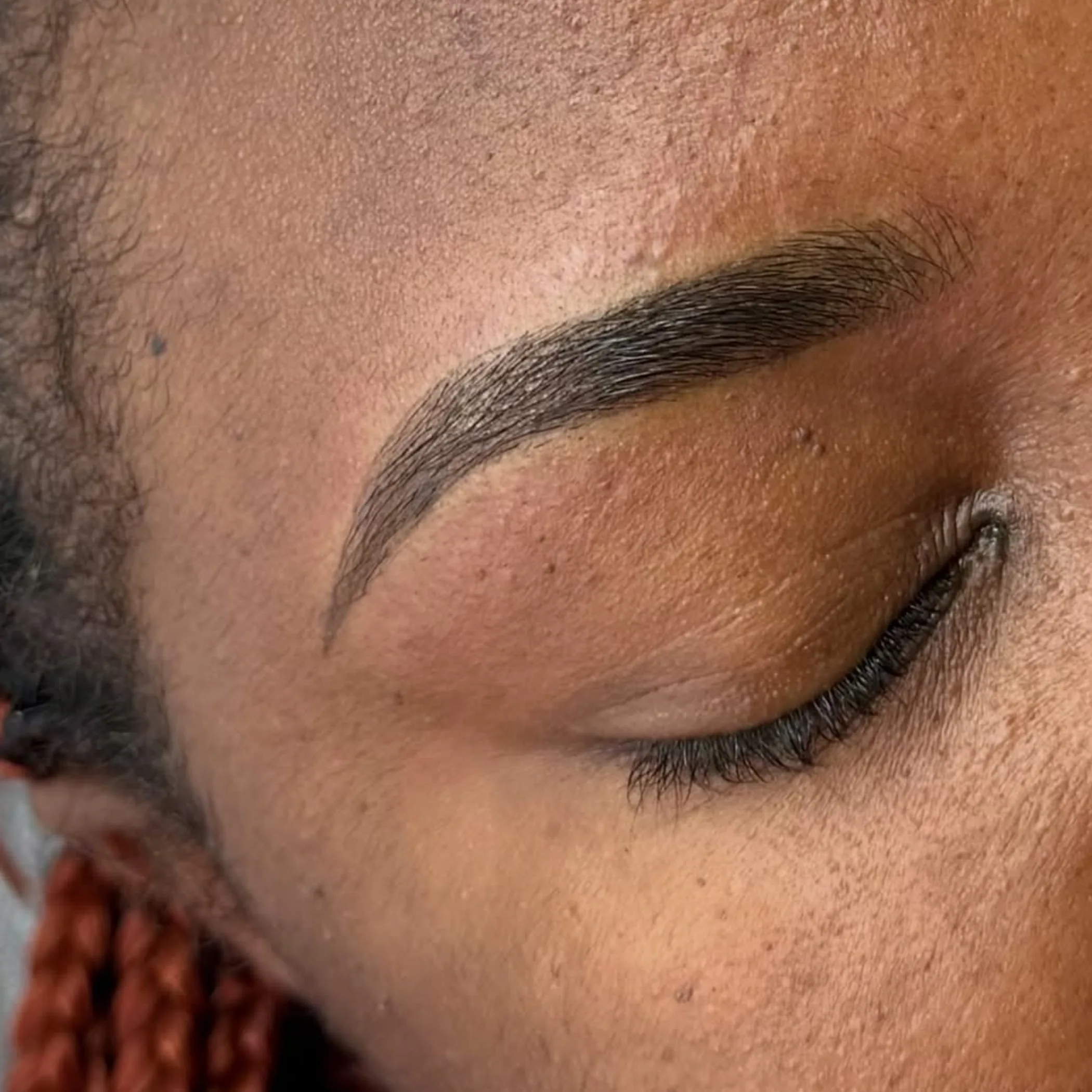 close-up of permanent eyebrow tattoo